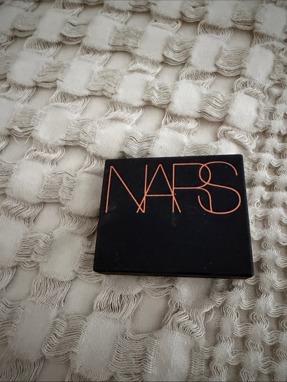 NARS Black Compact with Coral Logo